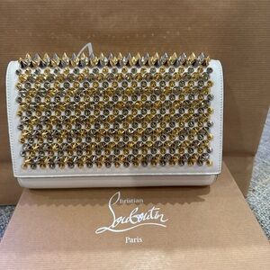 CHRISTIAN LOUBOUTIN 
Calfskin Patent Spikes Paloma Clutch Gold Silver